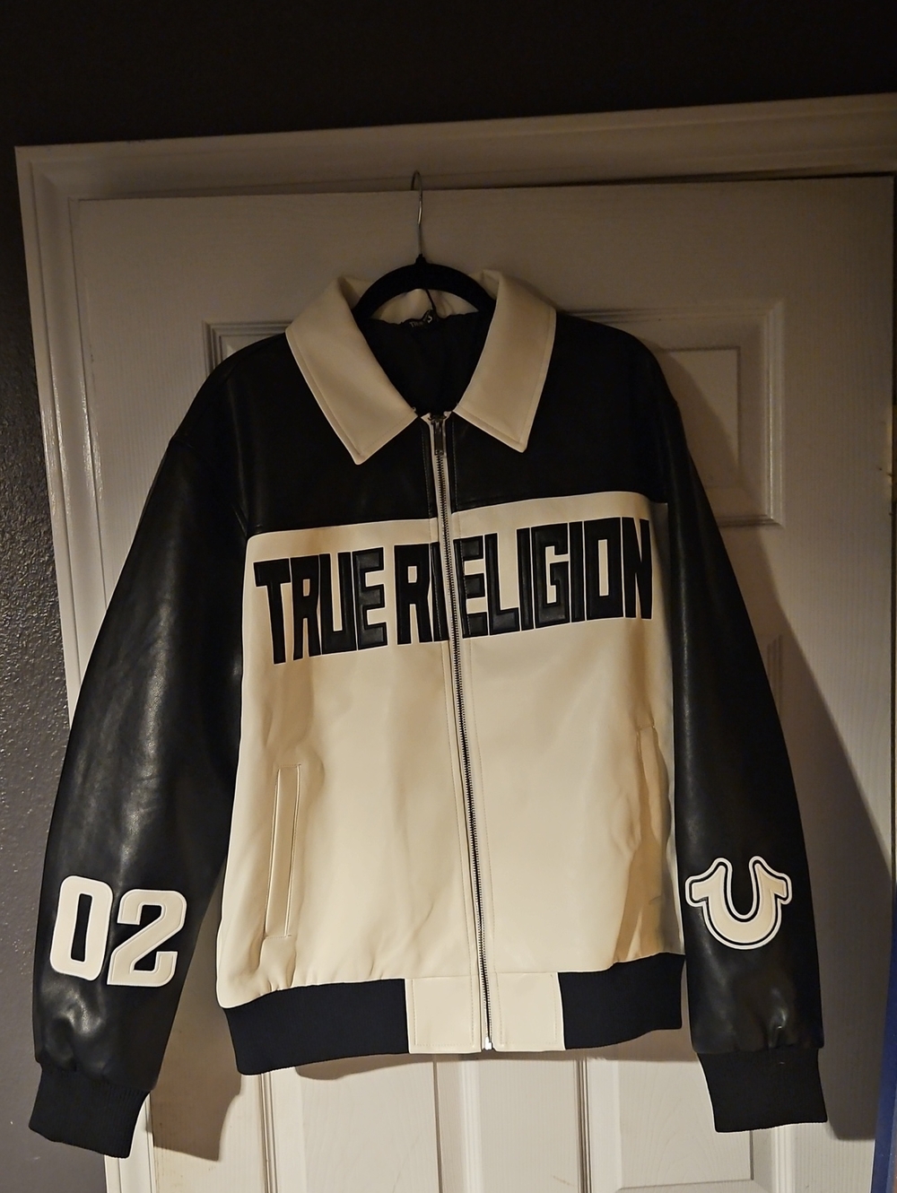 True Religion Black and Cream Leather Men’s Backpack with Embossed Logo